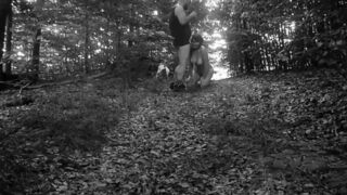 Naked submissive slut walked on a leash through the woods