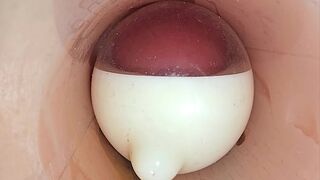 The camera in the deep pussy records a huge ejaculation of sperm into the condom