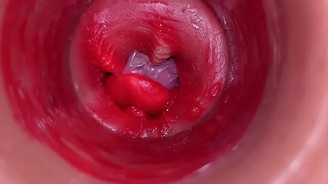 Close-up of a massive load trapped inside a slick slit &mdash;  captured in raw detail