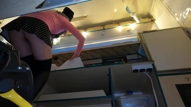 Amateur blonde hostess shows off her sultry backside in a miniskirt, revealing